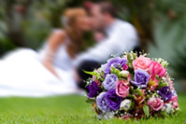 beautiful-bouquet-with-groom-and-bride-at-back-1374339